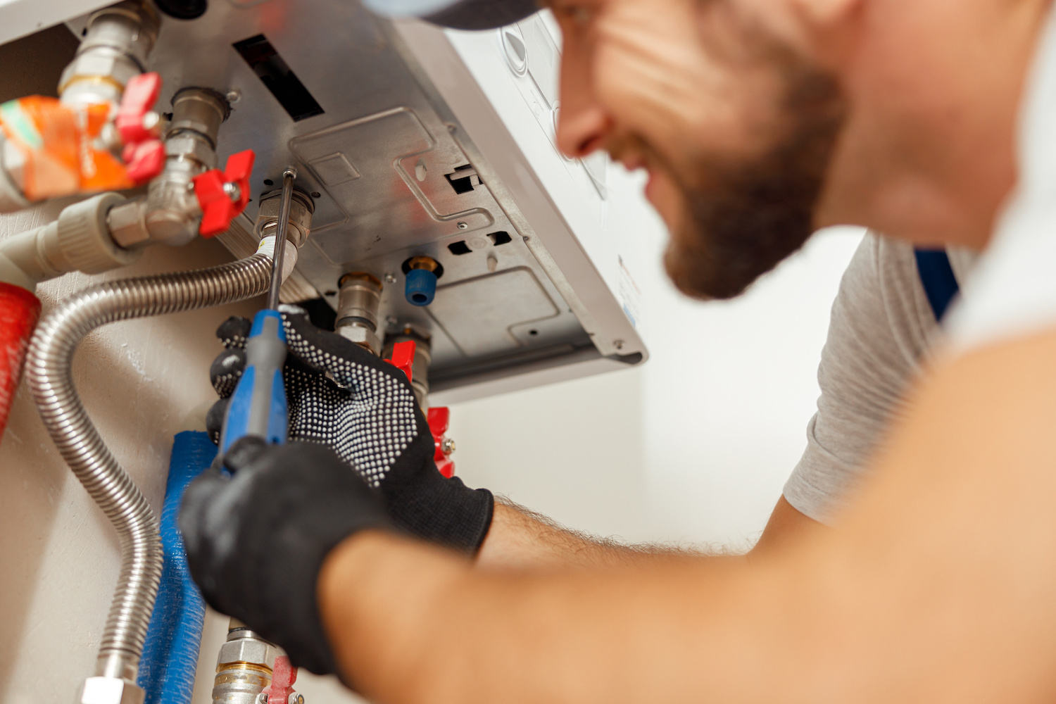 Gas engineer repairing a boiler