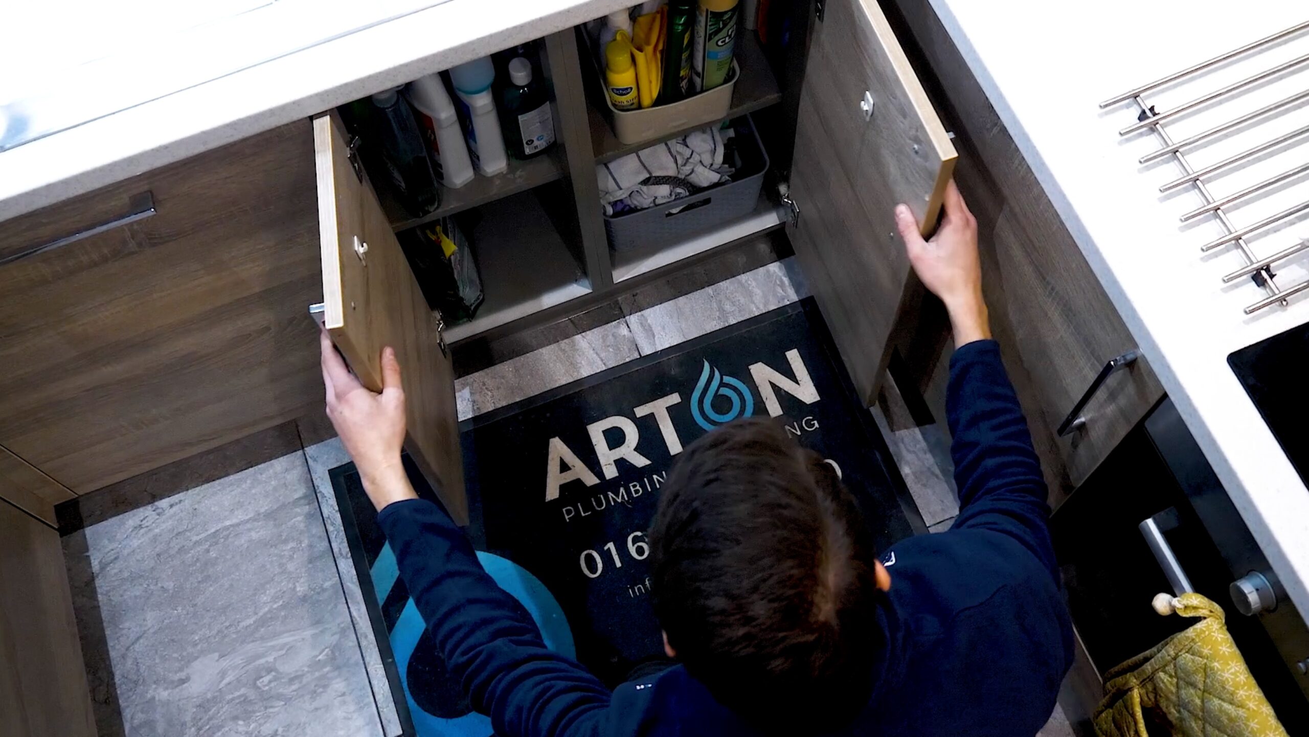 Heating engineer unloads new Worcester Bosch boiler from a van