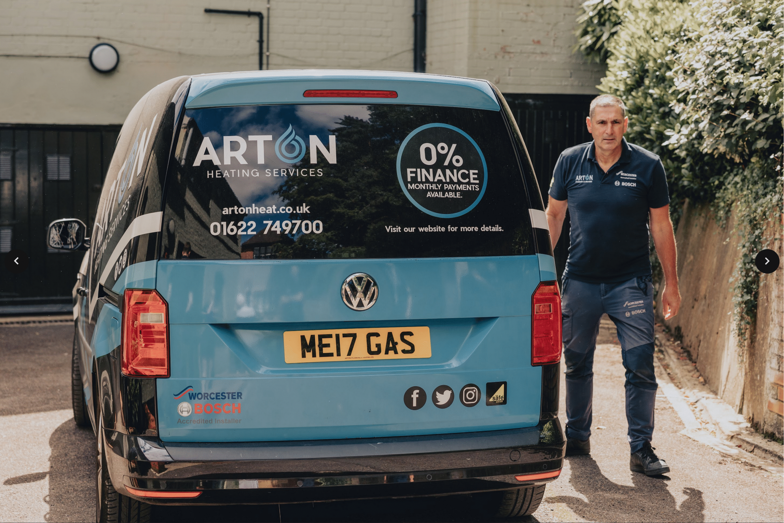 Heating engineer unloads new Worcester Bosch boiler from a van